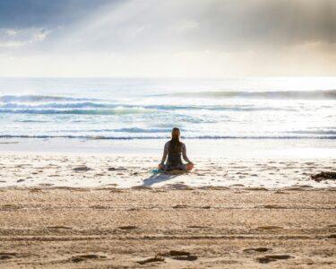 woman sitting on seashore