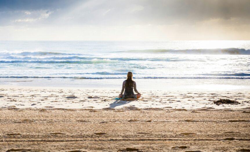 woman sitting on seashore