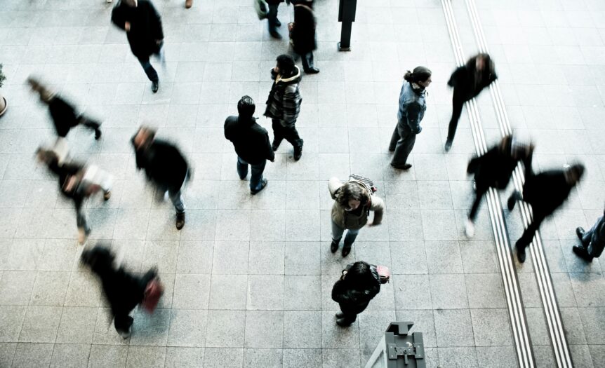 people walking on grey concrete floor during daytime