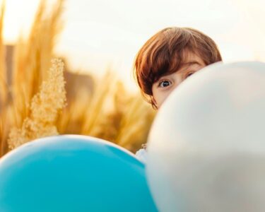 woman hiding on balloon