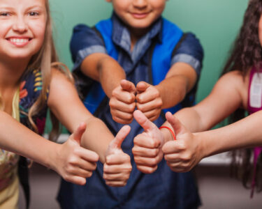 crop pupils with thumbs up 2