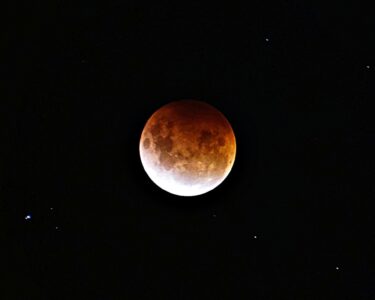 brown moon on black background
