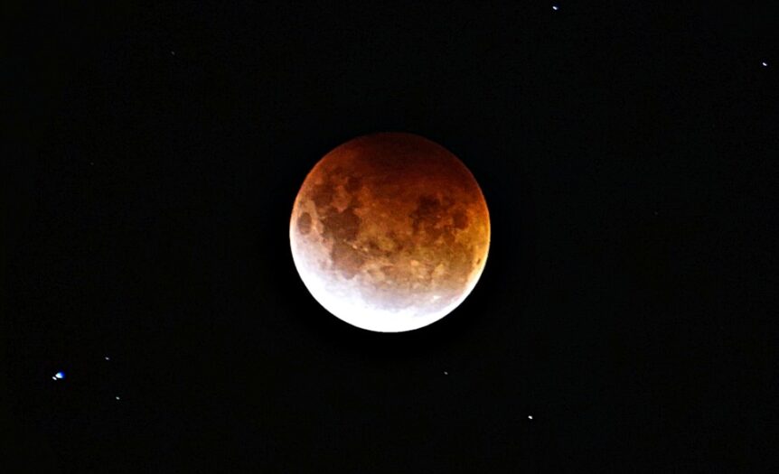 brown moon on black background