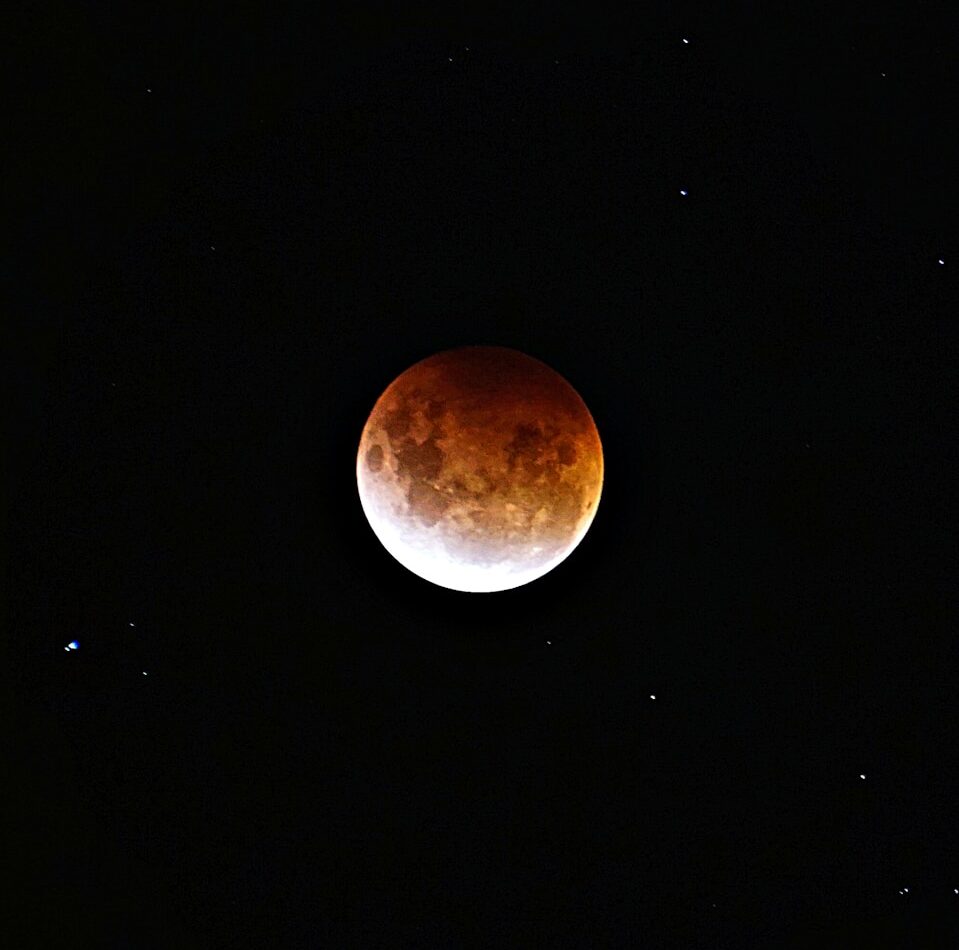 brown moon on black background