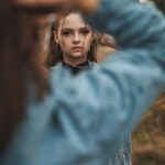 woman in blue long sleeve shirt