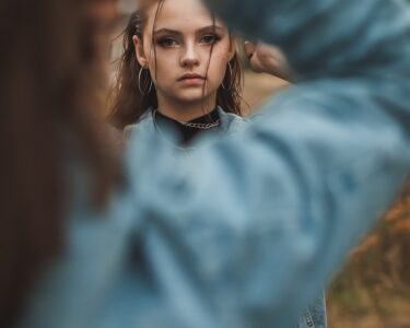 woman in blue long sleeve shirt