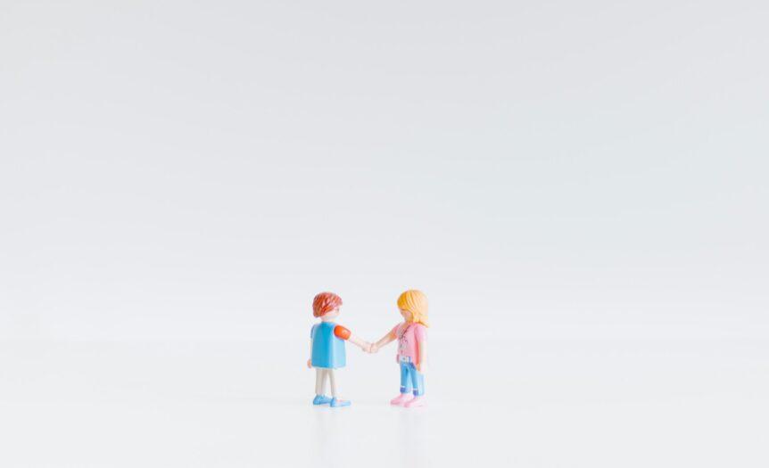 3 children in white and blue shirts