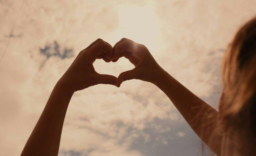 persons hand forming heart