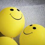 yellow smiley emoji on gray textile