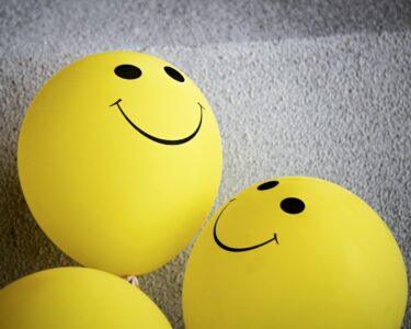 yellow smiley emoji on gray textile