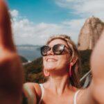 woman in white tank top wearing black sunglasses